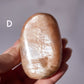 Flashy Peach Moonstone Palm Stone